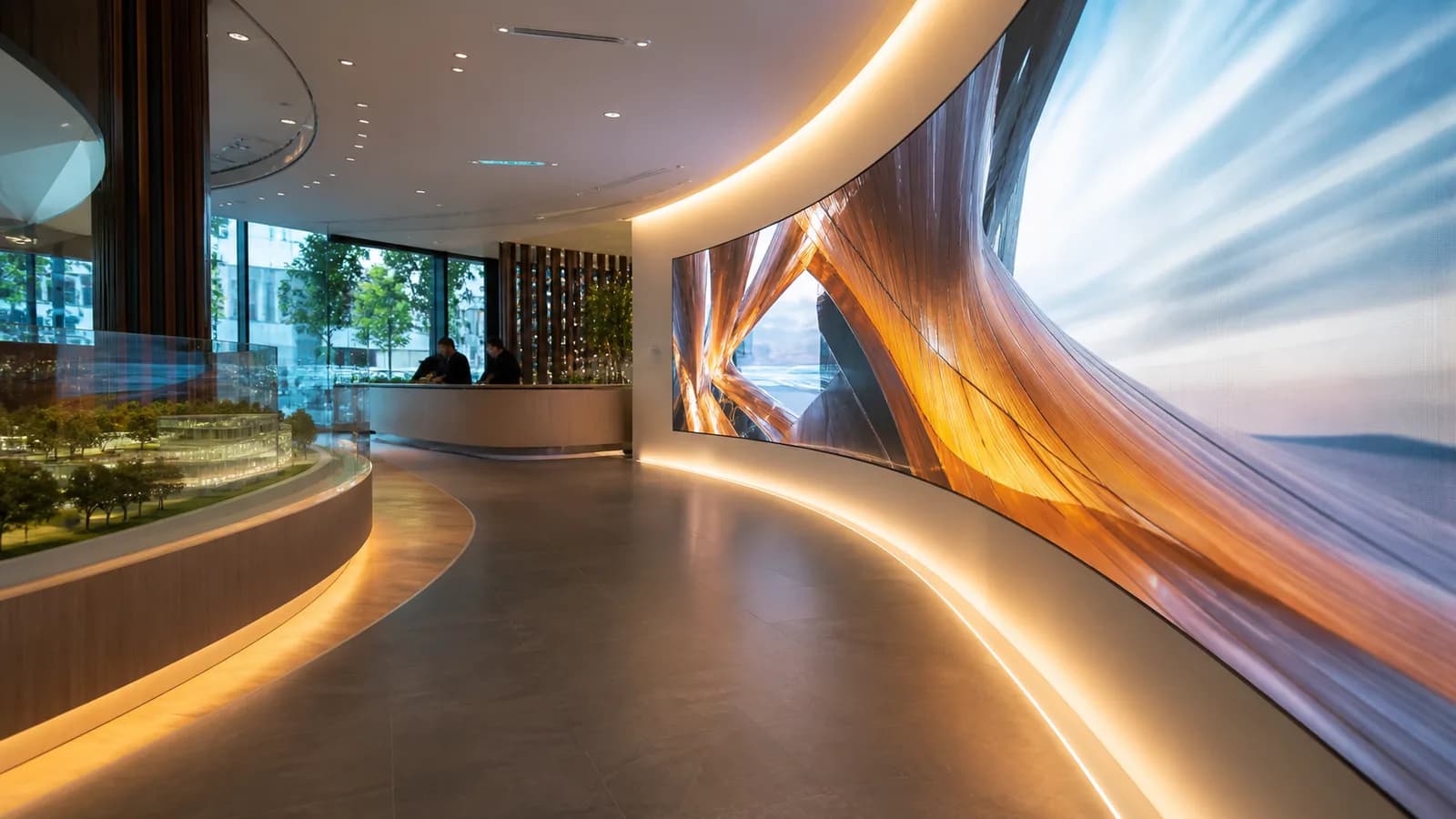 Curved LED ribbon wall guiding visitors through a showroom environment