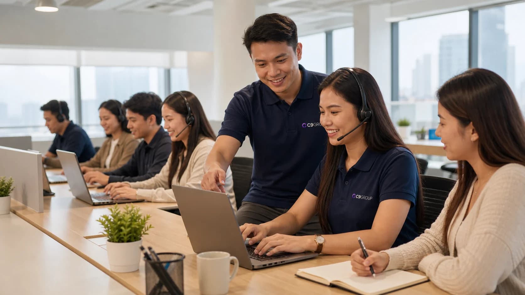 Filipino C9 GROUP workforce operations staff collaborating in a modern Philippines office